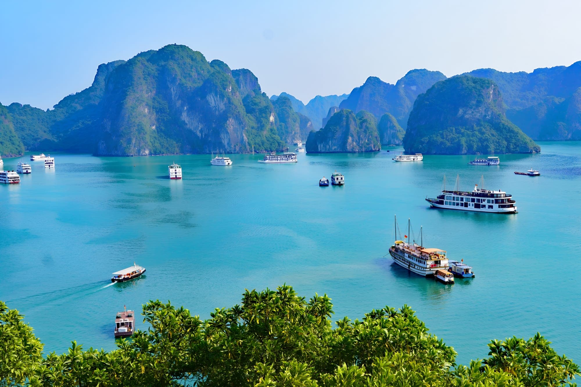 Ha Long Bay limestone karsts and cruise junks, Vietnam, across our Thailand and Vietnam operating regions